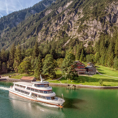 The Gaisalm at Lake Achensee The Gaisalm mountain hut is a beautiful place to stop by when hiking on the Mariensteig path from Achenkirch to Pertisau. This photo shows one of the Achensee ships leaving the jetty.
