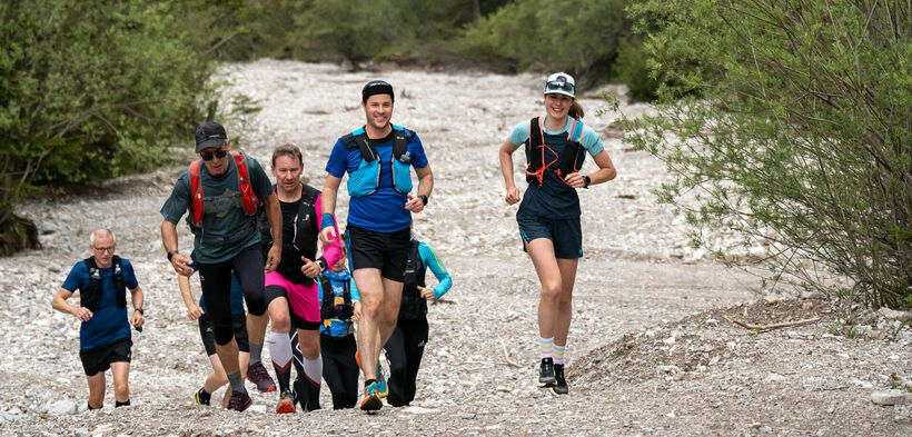 Running at Lake Achensee A group of runners out and about on gravel paths in the natural landscape of Lake Achensee.
