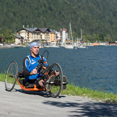 Handcycling at Lake Achensee Handcycling on the accessible path alongside the lakeshore in Pertisau.