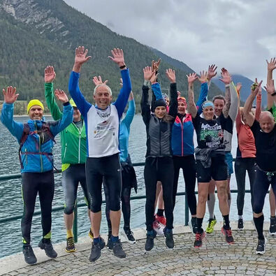 Running in Pertisau am Achensee A team photo of a running group at Lake Achensee.