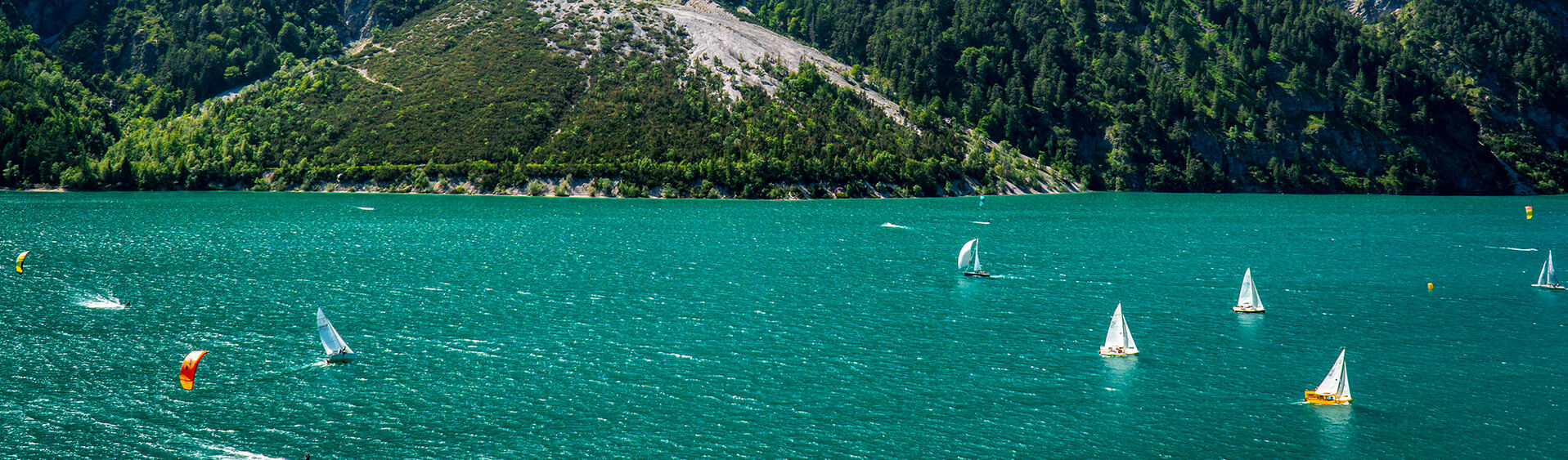 Sailing at Lake Achensee Lake Achensee offers perfect wind conditions for sailing, windsurfing and kitesurfing.