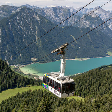 The Rofan cable car at Lake Achensee The Rofan cable car transports visitors directly from Maurach up the mountain. On the top, the AIRROFAN zipline is an attraction for thrill-seekers.